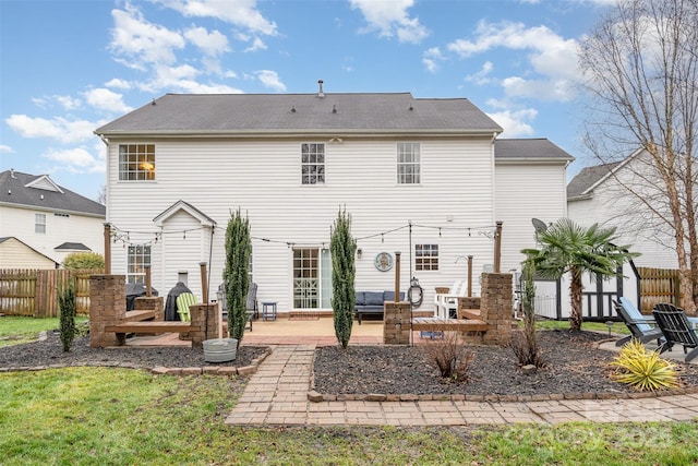 rear view of house with a patio