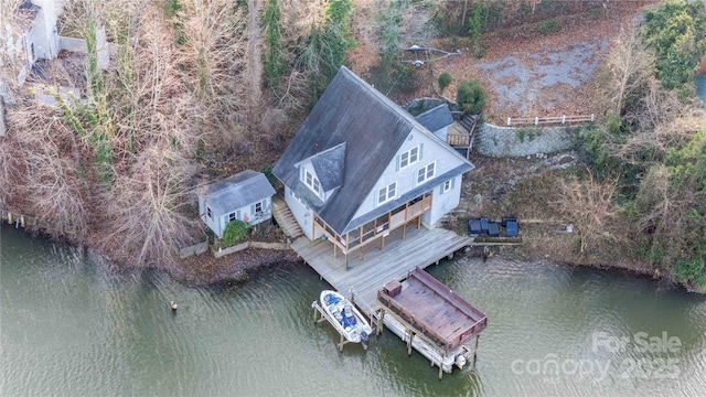 birds eye view of property featuring a water view