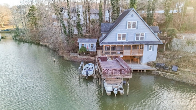 view of dock featuring a deck with water view