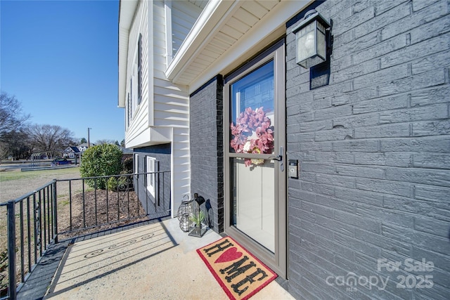 doorway to property featuring covered porch