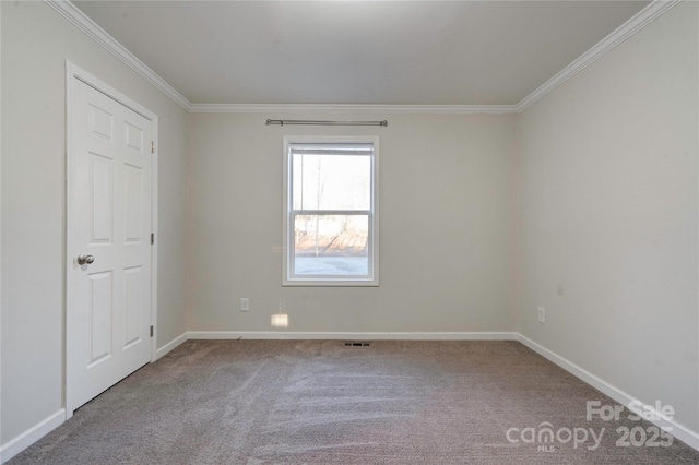 unfurnished room with carpet and crown molding