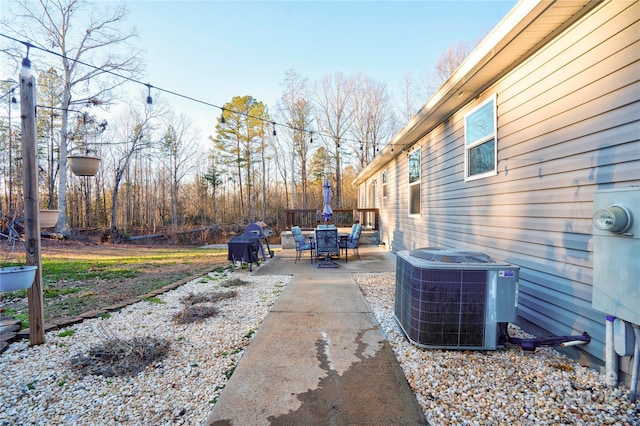 view of yard with a patio and central AC unit