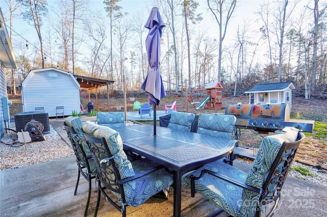 view of patio with a shed and central AC unit