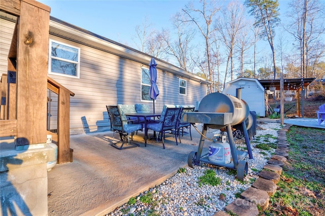 view of patio featuring a storage unit