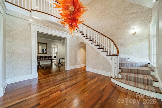 foyer featuring a high ceiling and dark hardwood / wood-style floors