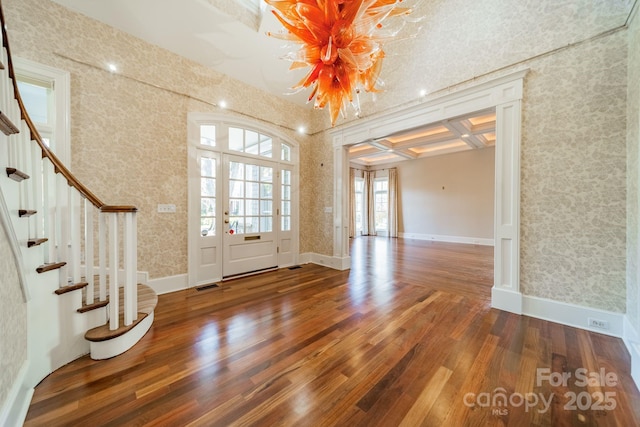 foyer featuring beam ceiling, hardwood / wood-style flooring, and coffered ceiling