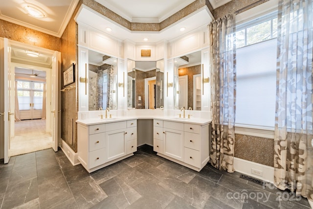 bathroom with vanity and ornamental molding