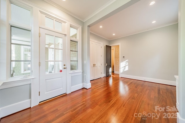 interior space featuring hardwood / wood-style flooring and ornamental molding