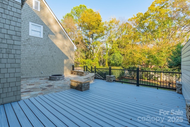 deck with a fire pit