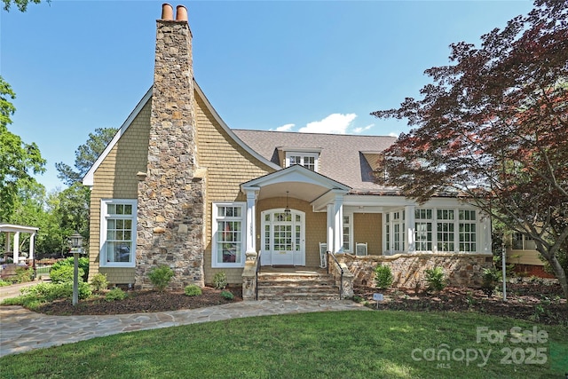 1333 Carlton Ave, Charlotte, NC 28203 - view of front of house with a front lawn, a chimney, and roof with shingles