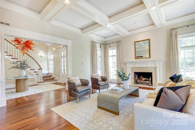 1333 Carlton Ave, Charlotte, NC 28203 - living room with coffered ceiling, wood finished floors, a premium fireplace, beam ceiling, and stairs