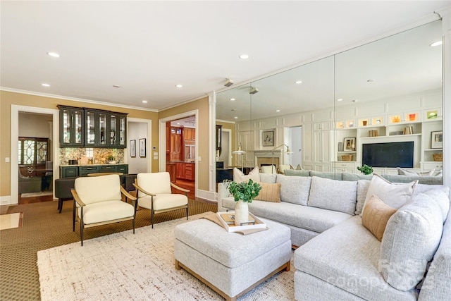 1333 Carlton Ave, Charlotte, NC 28203 - living room featuring baseboards, crown molding, indoor bar, and recessed lighting