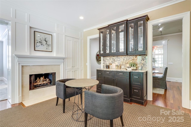 1333 Carlton Ave, Charlotte, NC 28203 - bar featuring backsplash, dark wood-style flooring, ornamental molding, and recessed lighting