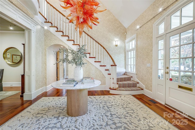 1333 Carlton Ave, Charlotte, NC 28203 - foyer entrance with wallpapered walls, wood finished floors, and visible vents