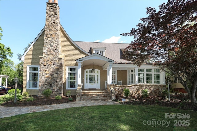 1333 Carlton Ave, Charlotte, NC 28203 - view of front facade with a chimney, roof with shingles, and a front yard