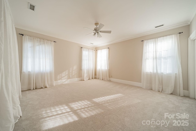 1333 Carlton Ave, Charlotte, NC 28203 - carpeted empty room with visible vents, crown molding, baseboards, and ceiling fan