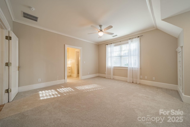 1333 Carlton Ave, Charlotte, NC 28203 - unfurnished bedroom with visible vents, ornamental molding, connected bathroom, baseboards, and light colored carpet