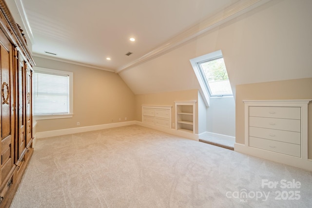 1333 Carlton Ave, Charlotte, NC 28203 - bonus room featuring baseboards, built in shelves, plenty of natural light, and light colored carpet