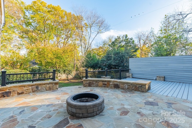 1333 Carlton Ave, Charlotte, NC 28203 - view of patio / terrace featuring a wooden deck, a fenced backyard, and an outdoor fire pit