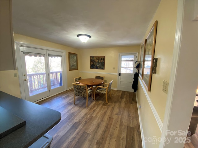 dining space featuring dark hardwood / wood-style flooring