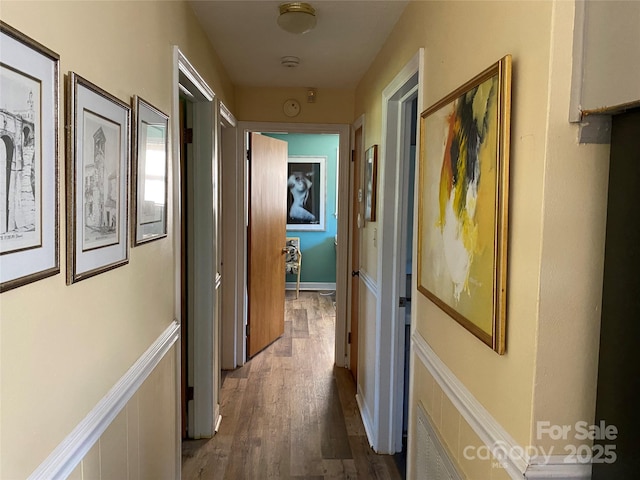 corridor featuring dark wood-type flooring