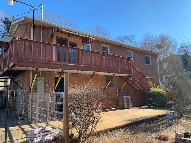 back of property featuring cooling unit and a patio area