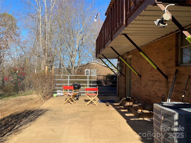 view of patio featuring a balcony and central AC unit