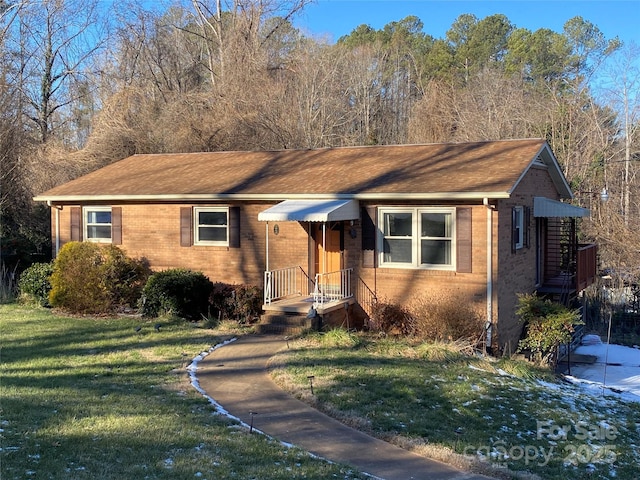 ranch-style home with a front yard