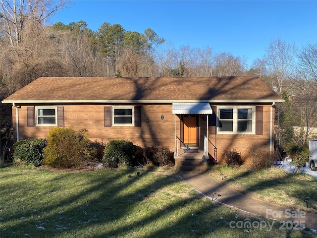 ranch-style house with a front lawn