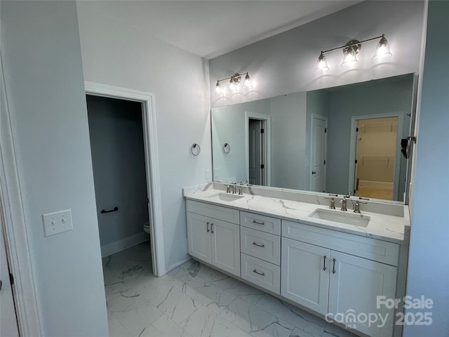 bathroom with vanity and toilet