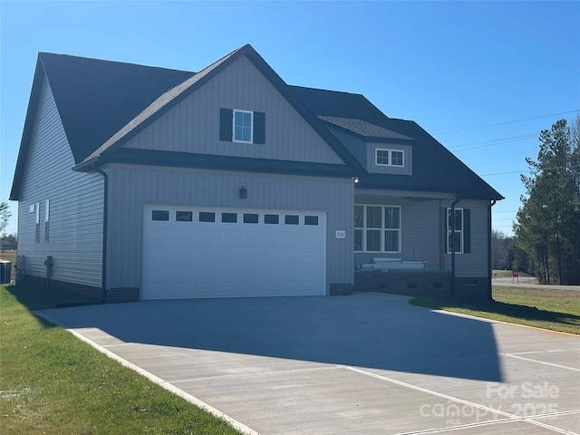 view of front of home with cooling unit and a garage