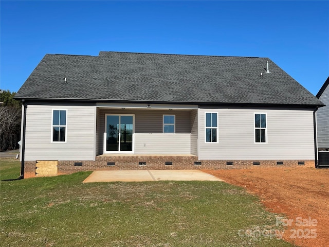 rear view of property with a yard, a patio area, and central air condition unit