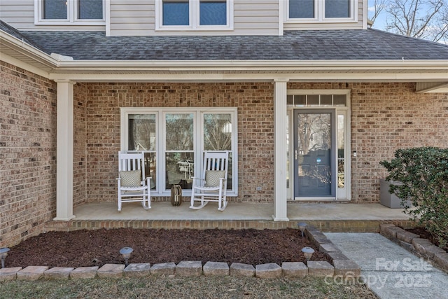 entrance to property featuring covered porch