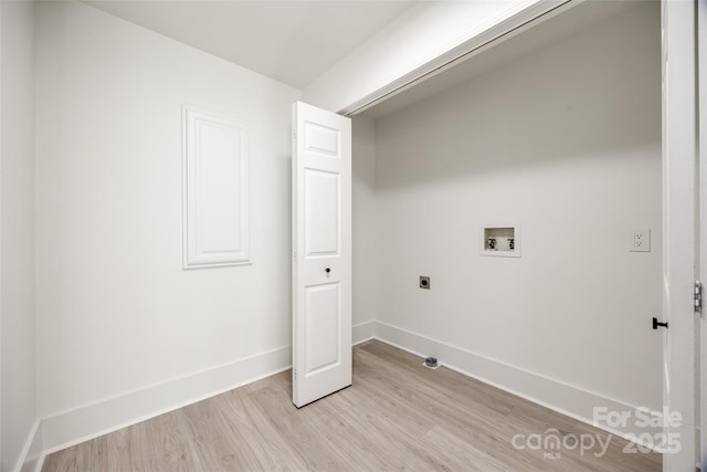 laundry room featuring electric dryer hookup, washer hookup, and light wood-type flooring