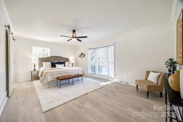 bedroom with light hardwood / wood-style flooring, ceiling fan, and ornamental molding