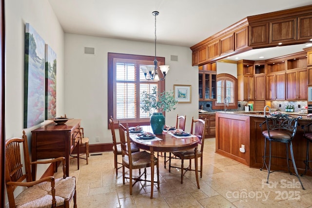 dining space featuring an inviting chandelier