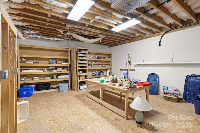 basement with a workshop area