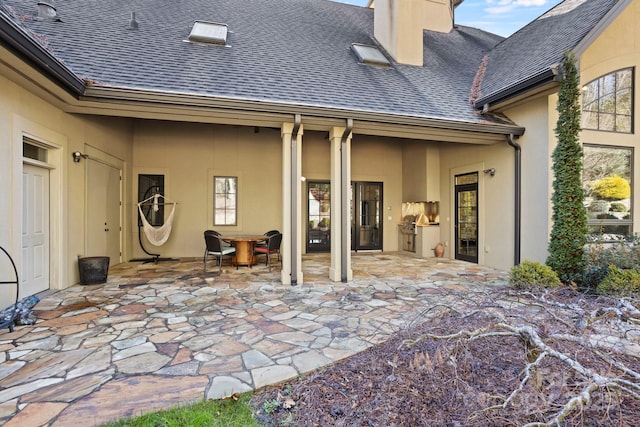 rear view of house featuring a patio area