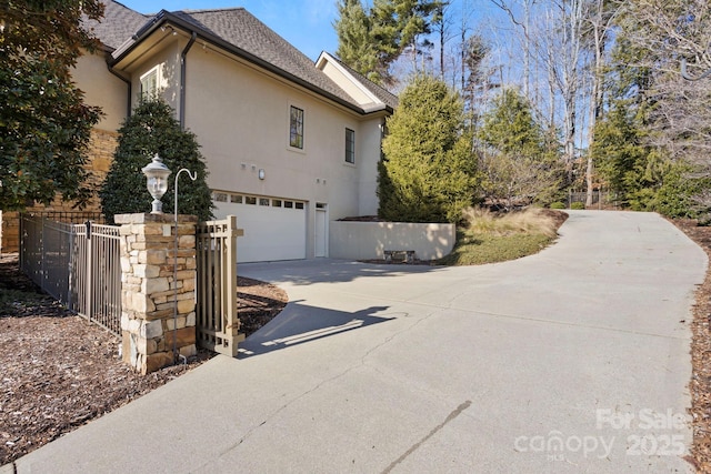 view of side of property with a garage