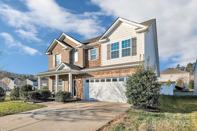 view of front of house featuring a front lawn and a garage