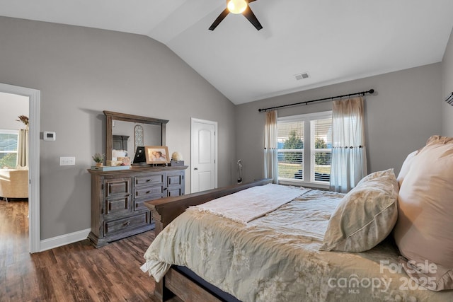 bedroom with lofted ceiling, ceiling fan, and dark wood-type flooring