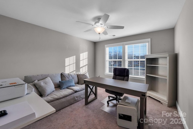 office with carpet flooring and ceiling fan