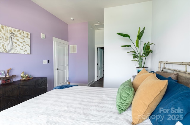 bedroom featuring attic access and visible vents