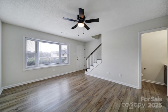 438 Stoneycreek Ln, Rock Hill, SC 29730 - unfurnished living room featuring hardwood / wood-style floors, a textured ceiling, and ceiling fan