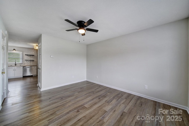 438 Stoneycreek Ln, Rock Hill, SC 29730 - spare room featuring ceiling fan, sink, and dark wood-type flooring