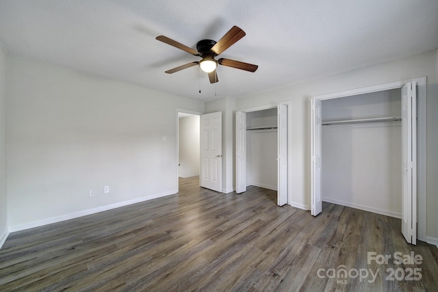 438 Stoneycreek Ln, Rock Hill, SC 29730 - unfurnished bedroom featuring ceiling fan, dark hardwood / wood-style flooring, and two closets