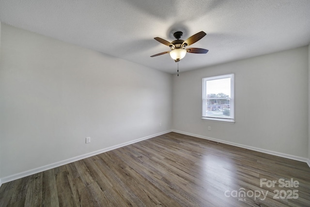 438 Stoneycreek Ln, Rock Hill, SC 29730 - spare room featuring ceiling fan, dark wood-type flooring, and a textured ceiling