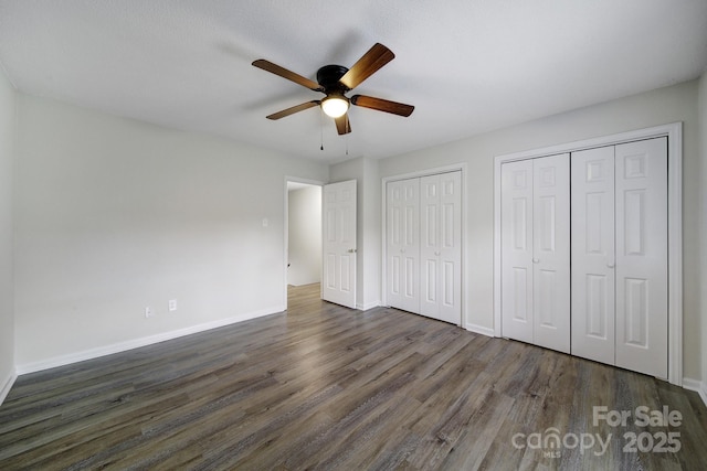 438 Stoneycreek Ln, Rock Hill, SC 29730 - unfurnished bedroom with dark hardwood / wood-style flooring, ceiling fan, and multiple closets