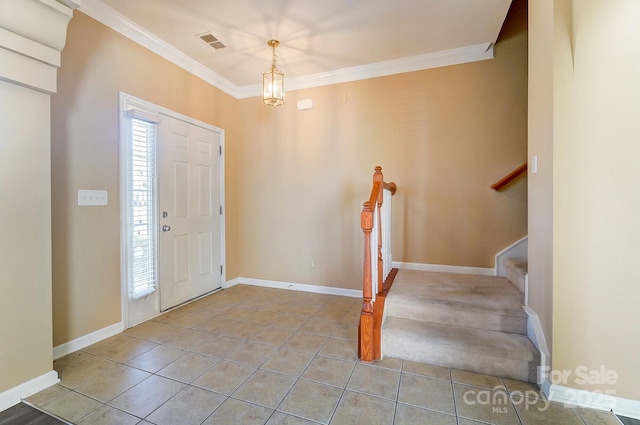 entryway featuring plenty of natural light, light tile patterned floors, and ornamental molding