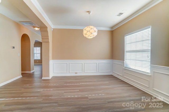 spare room with crown molding